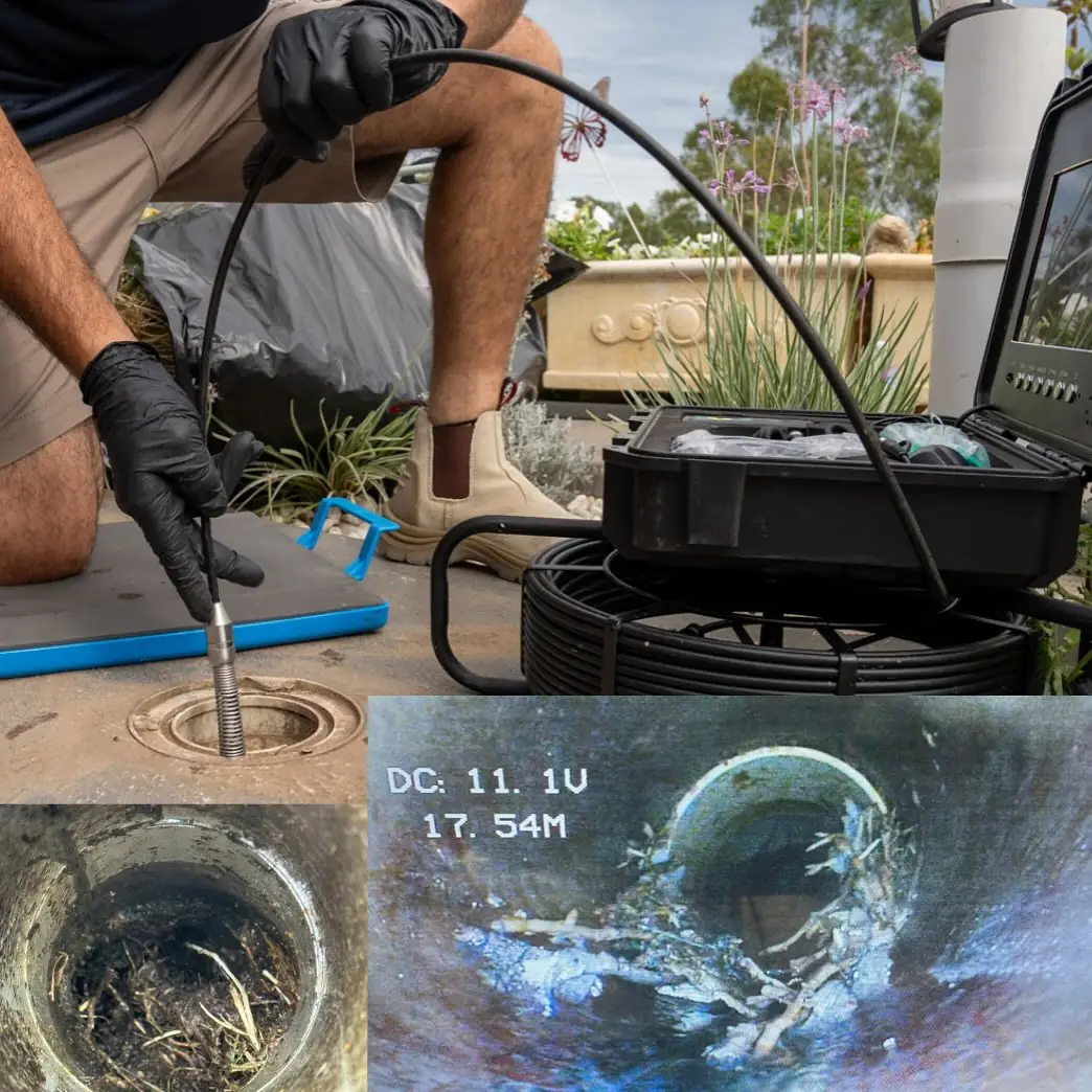 Drain camera equipment beside an outdoor inspection opening