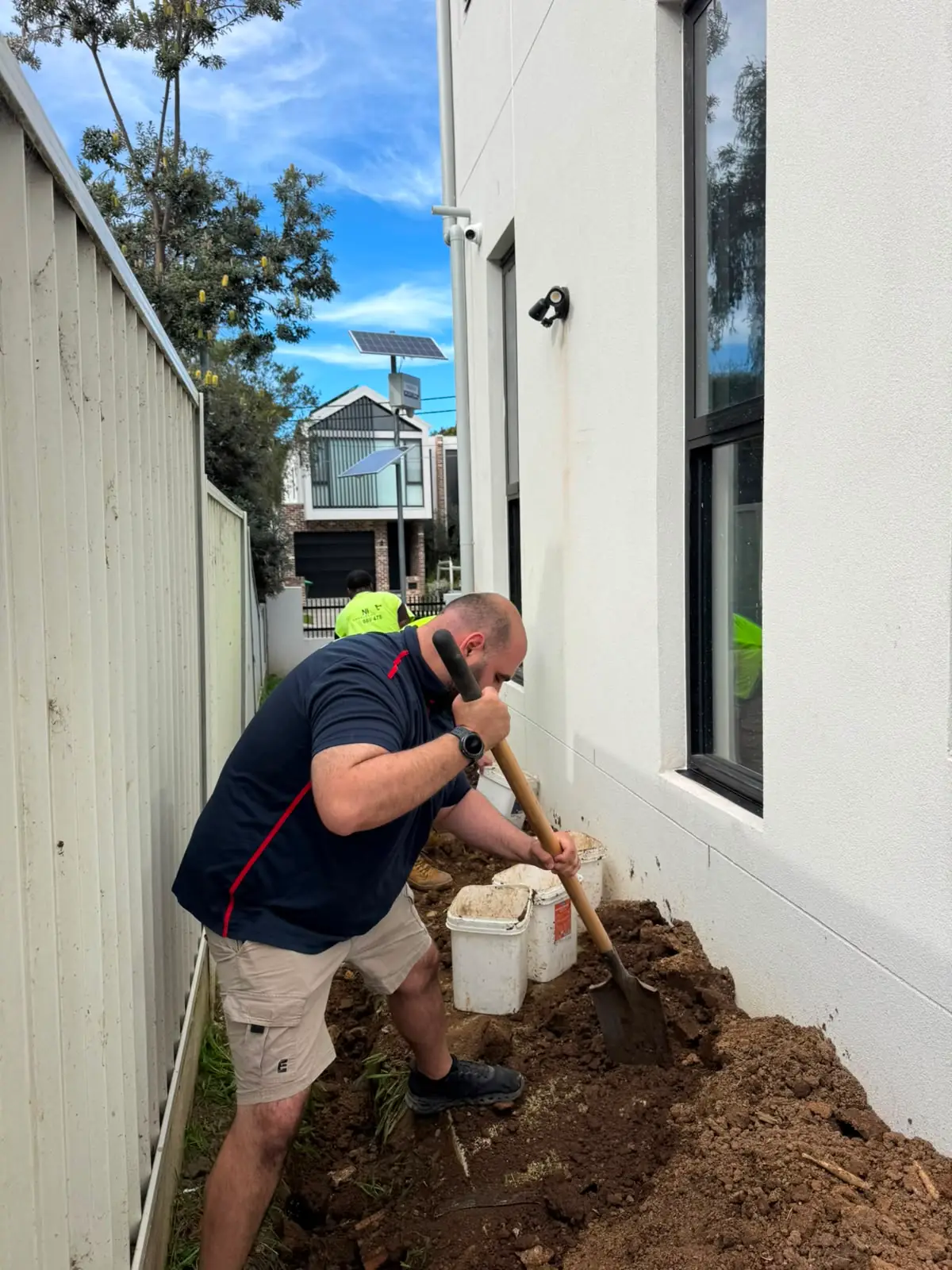 Antons plumber excavating beside a home to reach underground pipework