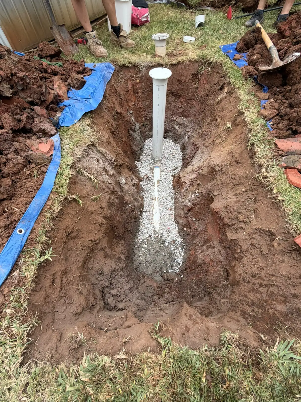 Underground drainage repair with pipework laid on gravel bedding